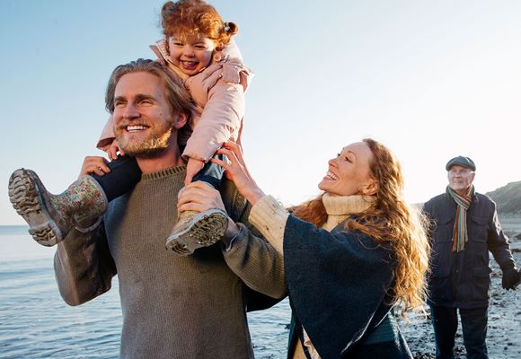 family walking on beach